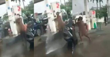 Naked woman hijacks fuel pump and sprays petrol on customers at Petrol station in Falomo (+Video)