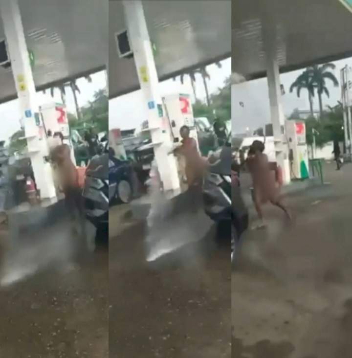 Naked woman hijacks fuel pump and sprays petrol on customers at Petrol station in Falomo (+Video)