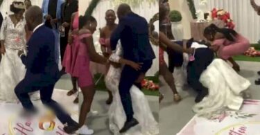 Moment couple suffered embarrassing fall while dancing at their wedding reception (Video)