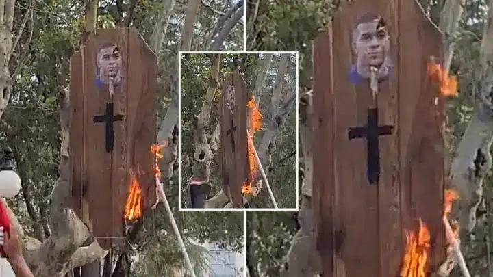 Argentina fans burn a coffin with Mbappe's face during trophy parade