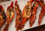 Baked garlic prawns with roasted peppers & gremolata toasts Recipe