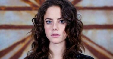 Kaya Scodelario Poses While Feeding Pigs In Antigua